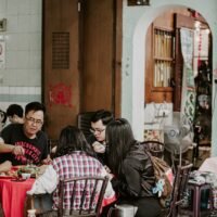 people sitting on chair in restaurant