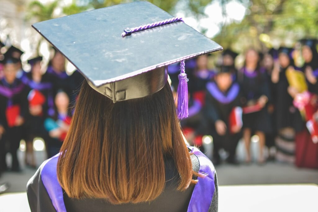 "100 Job Applications, One Interview" - What Challenges Does Youth Face in Employment? 2 woman wearing academic cap and dress selective focus photography