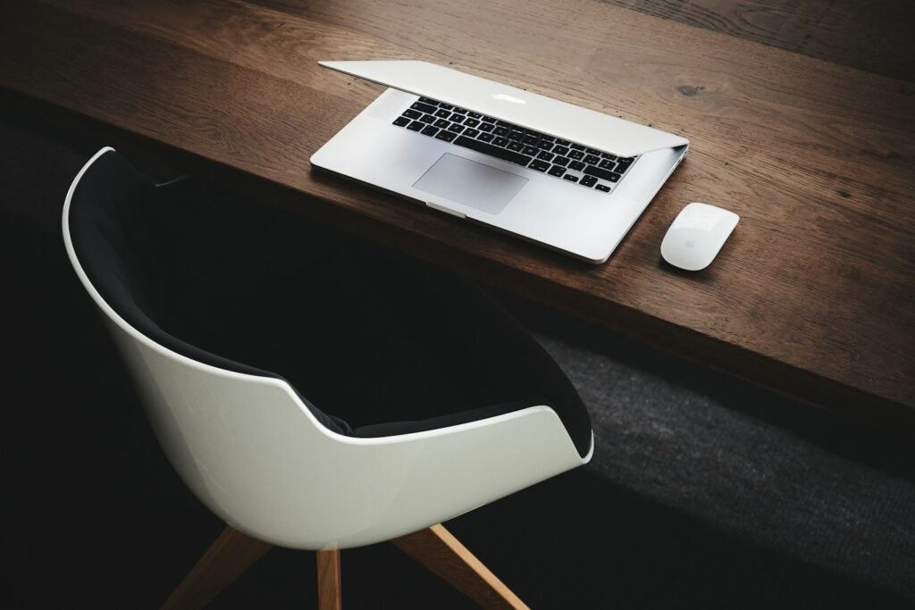 Ten new policies in 2025 that you should know 7 Apple MacBook beside computer mouse on table