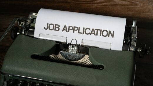 a typewriter with a job application printed on it